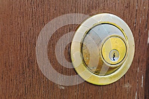 Closeup of old rusty door lock on wooden background. Beautiful v