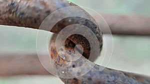 Closeup of old rusty interlinked chains