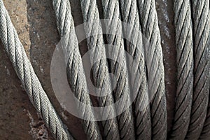 Closeup on old and rusty steel cable of crane the lifting machine