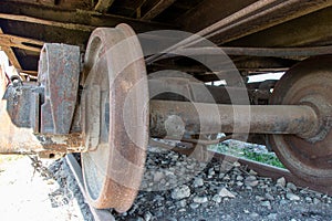 Closeup of the old rusty train wheels. Details of the wheel of train.