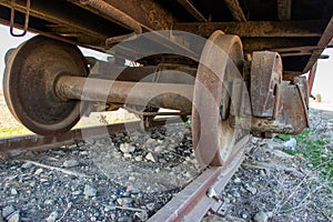 Closeup of the old rusty train wheels. Details of the wheel of train.