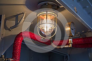 Vintage lighting on a ship.
