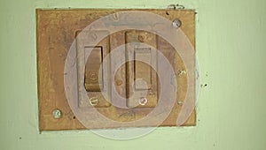 Closeup of old switch board on wall.