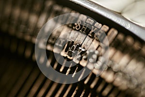 Closeup of old typewriter plates strikers strykers with letters and symbols for typing