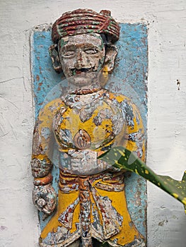 A Closeup of an old weathered paint sculpture of an soldier at Maheshwar India