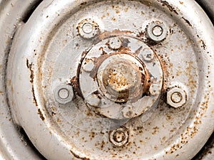 Closeup old wheel mag alloy , rusty, dirty