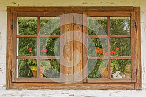 Closeup of old wooden windows with flowers