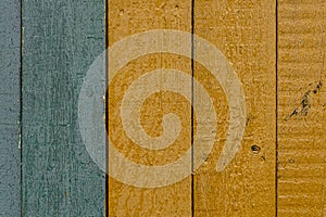 Closeup of old yellow and green wood planks texture background