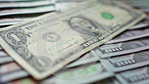 Closeup one old style american dollar is on a lot of new hundred dollar bills. Money, Cash banknotes. Finance and