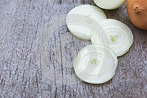 Closeup onion sliced on wood background, food ingredient concept