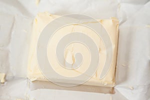 Closeup of open bricket of butter
