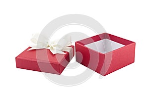 Closeup open and empty red gift box with double white ribbon bow isolated on white background