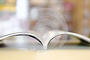 Opened magazine on the white table