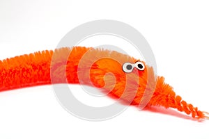 Closeup of an orange magic twisty worm. children`s toys.