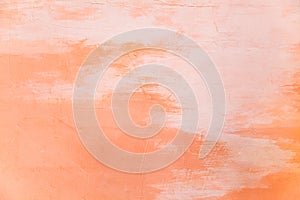 Closeup orange pantone color painted on wall surface background. House interior, home decorating, building exterior design,