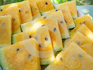 Closeup - Organic yellow watermelon triangles, vegetarian nutrition,healthy eating