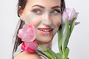 Closeup ortrait of young brunette beautiful woman with makeup in