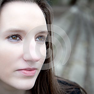 Closeup outdoor portrait of a pretty young woman