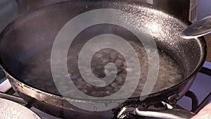 Closeup over pan on stove boiling ingredients