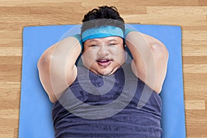 Closeup of overweight man exercising