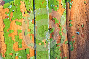 Closeup painted wooden board in a crack