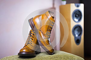 Closeup of Pair of Mens Tanned Semi-Brogue Boots on One Another