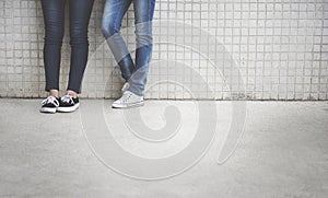 Closeup of pairs of legs in jeans