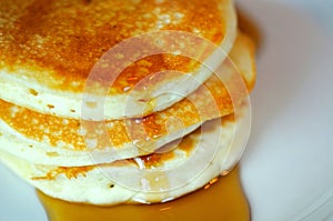 Closeup of pancakes with syrup photo
