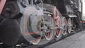 Closeup parts of old steam locomotive train wheels and rods. with original sound