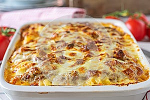Closeup of a pasta or noodle casserole with bolognese sauce, bechamel sauce and mozzarella cheese