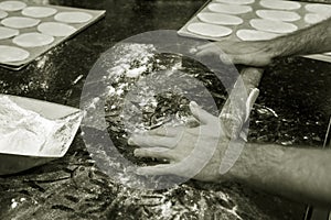 Pastrycook hands preparing dough for sweet pie