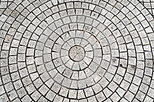 Closeup paving curved circle stone brick on pathway texture, abstract and background concept