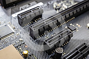 Closeup of Pci expess port slot on modern black motherboard.