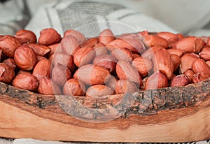 Closeup Peanuts-Groundnut ,wooden bawl On Background