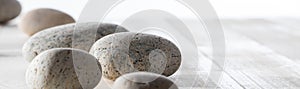 Pebbles for spirituality, ayurveda, mineral spa or mindfulness, long banner photo