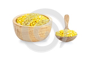 Closeup peeled mung bean in wooden bowl on white background, healthy food concept