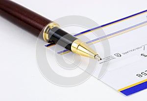 Closeup of pen on check