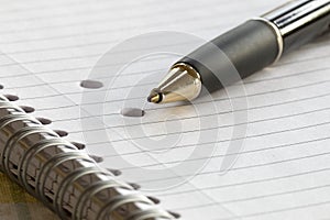 Closeup of a pencil on a writing pad