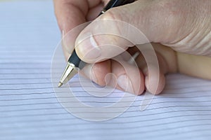 Closeup of a pencil on a writing pad