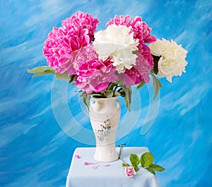 Closeup of peony flowers, fluffy pink peonies flowers, peony bunch in vase on the table