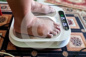 Closeup of person feet receiving magnetic therapy from electricity powered geomagnetic device, promising general well photo