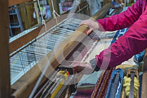 Closeup of a person making a rug in a factory in Alpujarra, Spain photo