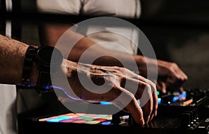 Closeup of a person playing songs and DJing - good for party-related categories