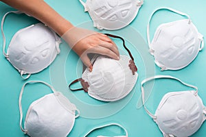 Closeup of a person's hands holding N95 respirator mask