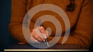 Closeup of a person writing on a tablet. Close up of a person working on a tablet. Woman working on a convertible