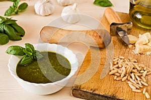 Closeup of pesto genovese with its ingredients