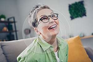 Closeup photo of attractive elderly businesswoman happy positive smiling dreaming wear eyeglasses fantasizing alone