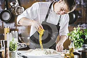 Closeup photo of baker cracking egg for dough. Retro styled imagery