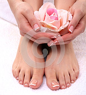 Closeup photo of a beautiful female feet with pedicure