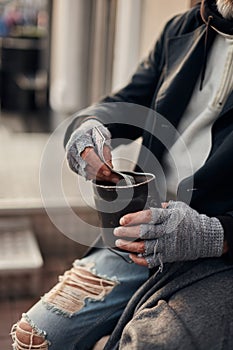 Closeup photo of beggar hands getting money